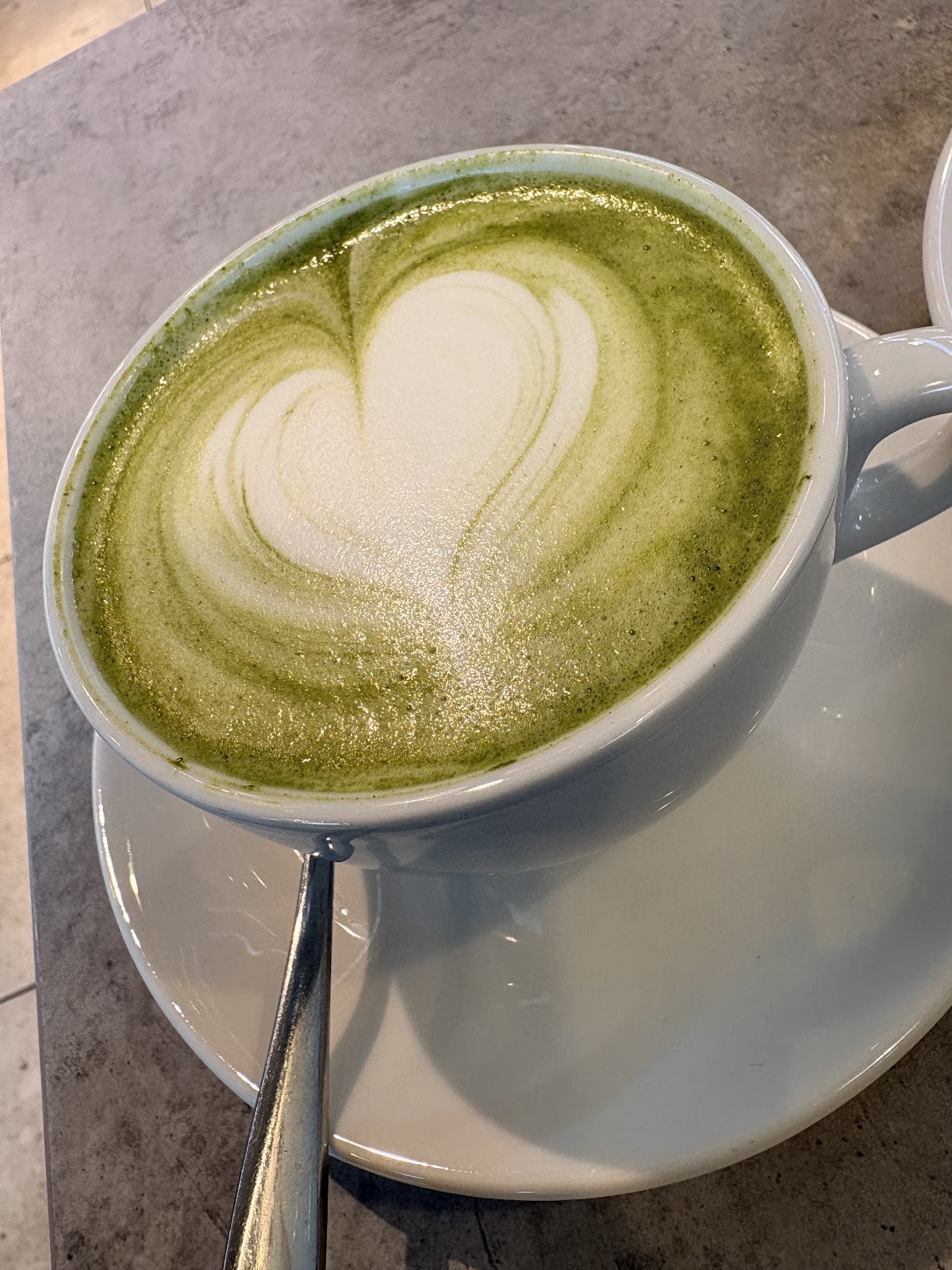 Matcha latte with a heart in the foam, from above